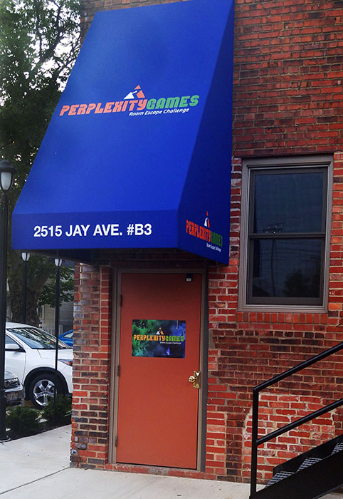 The blue awning is the sign for adventure! Perplexity Games offers exciting escape rooms in downtown Cleveland.